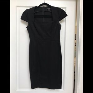 Black knee length dress. Thick material.